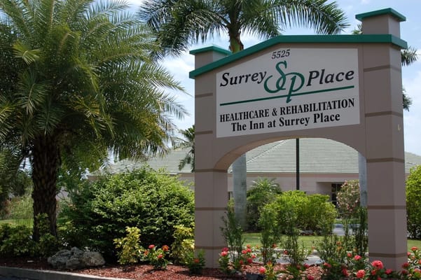 Sign for Surrey Place Healthcare & Rehabilitation surrounded by landscaping