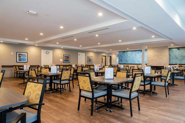 Spacious dining room with tables and chairs in Sweet Galilee.
