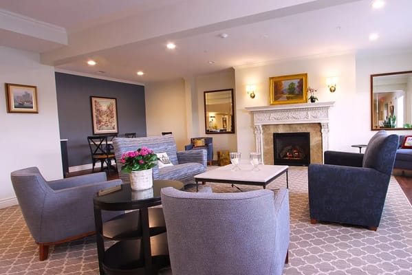 Cozy common area with seating and a fireplace