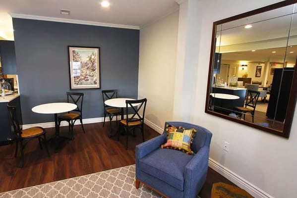 Cozy interior space with tables and a blue chair