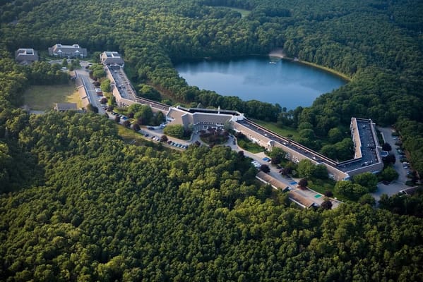 Aerial view of a senior living facility near a lake