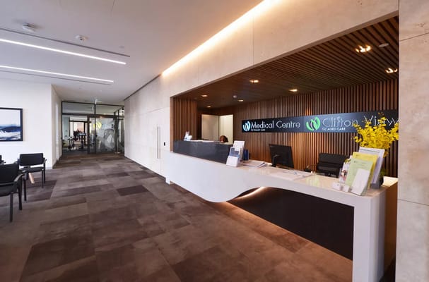 Reception area of the Medical Centre with wooden panels and office supplies