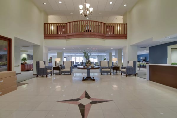 Interior view of a bright lobby area in a senior living facility