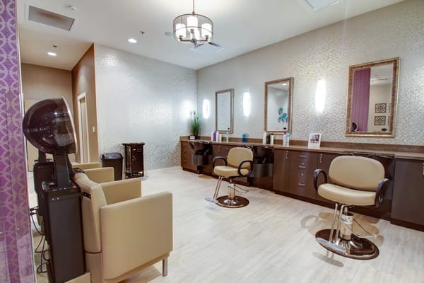 Well-equipped salon with styling chairs and mirrors