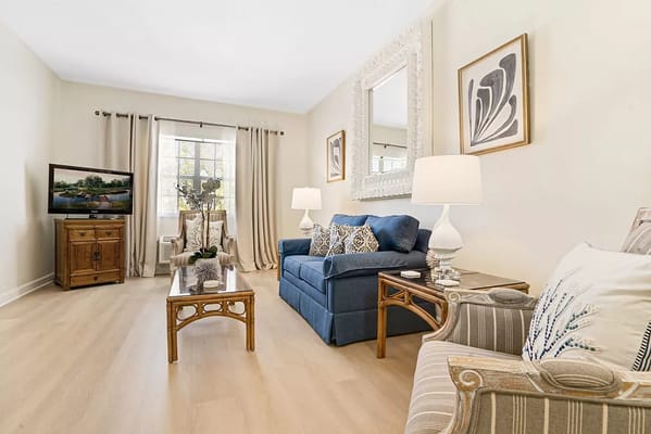 Cozy living room with blue sofa and wooden furniture