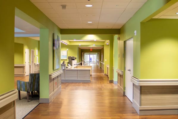 Brightly colored interior hallway of a senior living facility