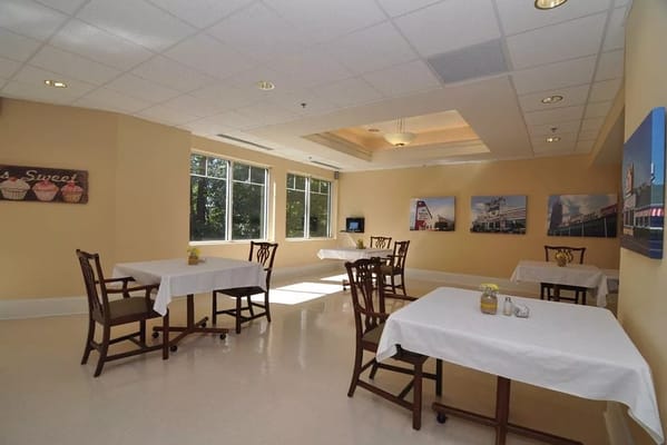 Bright dining area with tables and chairs