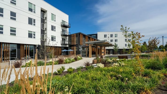 The entrance of The Ackerly at Reed's Crossing with landscaping