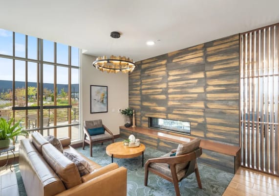 Cozy living room with modern furniture and large windows