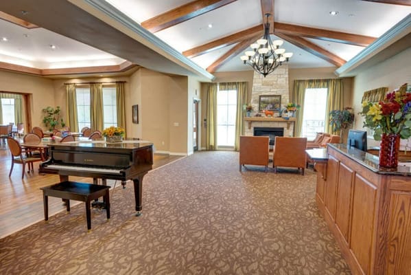 Common area of a senior living facility with a piano