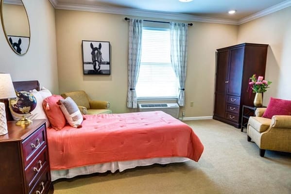 Cozy resident room with a bed and seating area