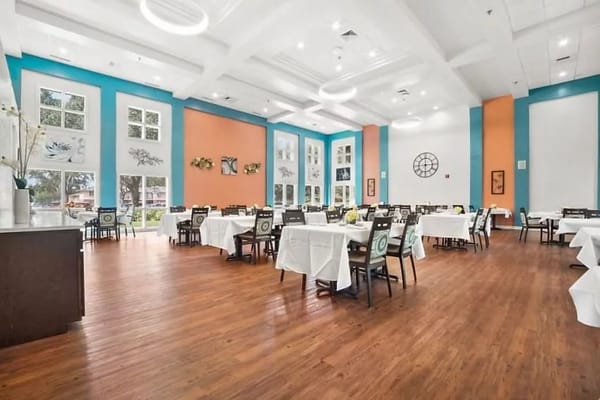 Bright dining room with tables and chairs