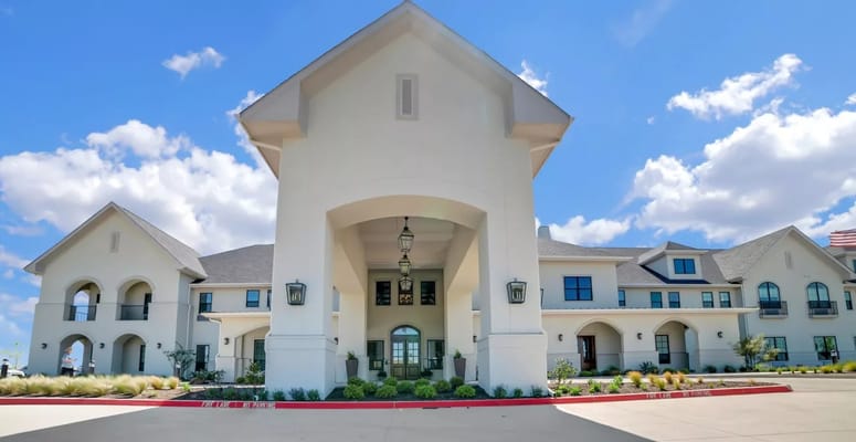 Front view of The Blake at Waco senior living facility under a sunny sky.
