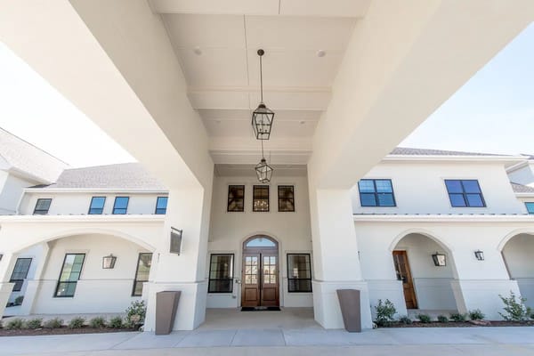 Entrance area with decorative lanterns and a large doorway