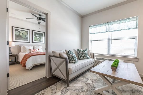 Cozy living room with a view of the bedroom