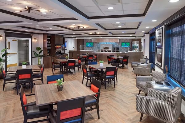 Cozy dining area with tables and chairs at The Bristal Assisted Living