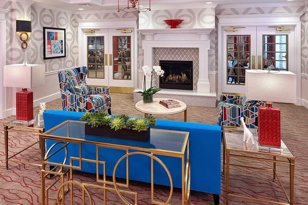 Stylish living room with colorful seating and a fireplace