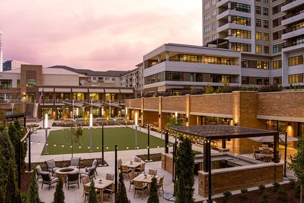 Outdoor common area with seating and landscaping