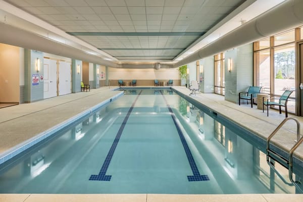 Indoor swimming pool with ample seating area