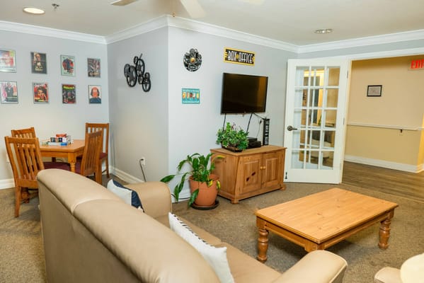 Interior view of a living room with comfortable seating and a dining area