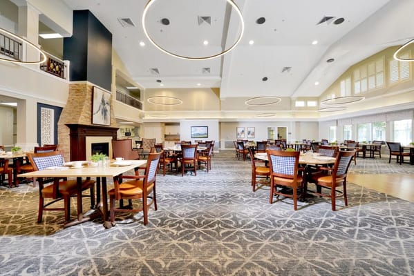 Interior view of the dining room with wooden tables and chairs