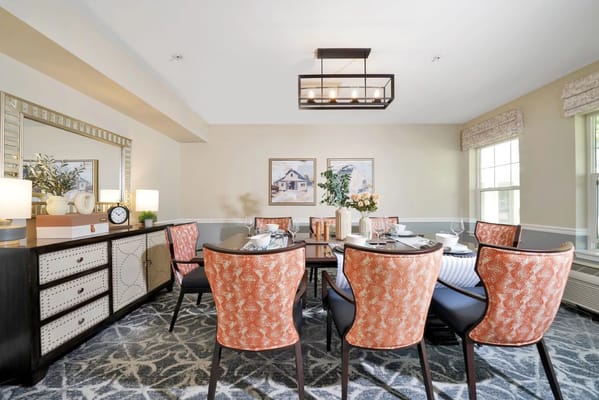 Dining room featuring a large table and stylish chairs.