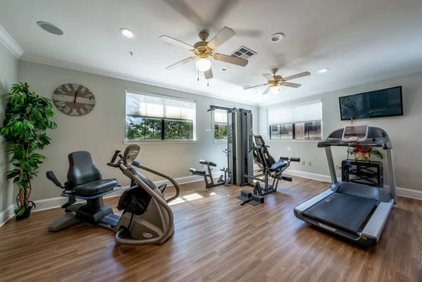 Fitness room with exercise equipment and natural light