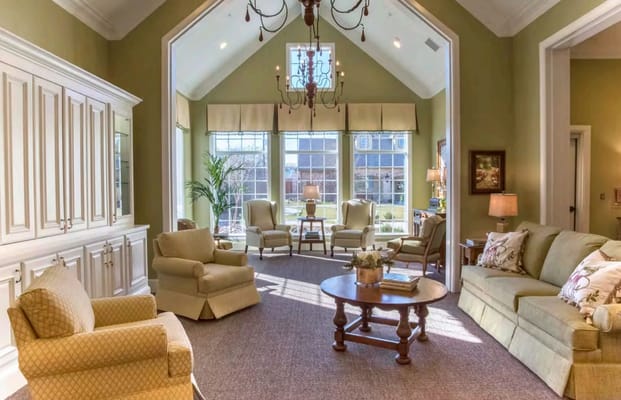 Bright and airy living room with comfortable seating and large windows