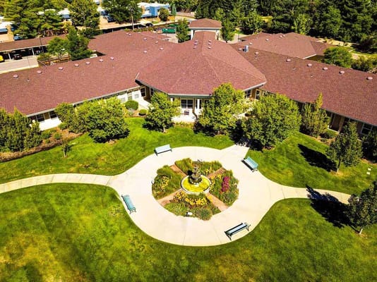 Aerial view of landscaped garden with seating area and fountain at The Courtyards at Mountain View.