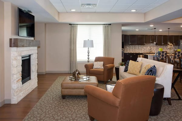 Cozy living room with comfortable seating and fireplace