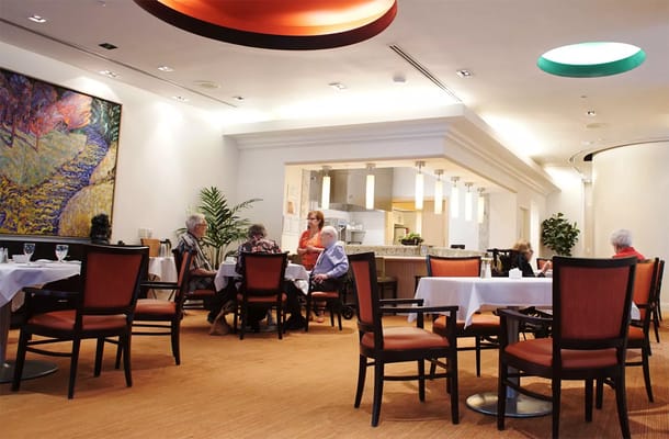 Residents enjoying a meal in the dining room