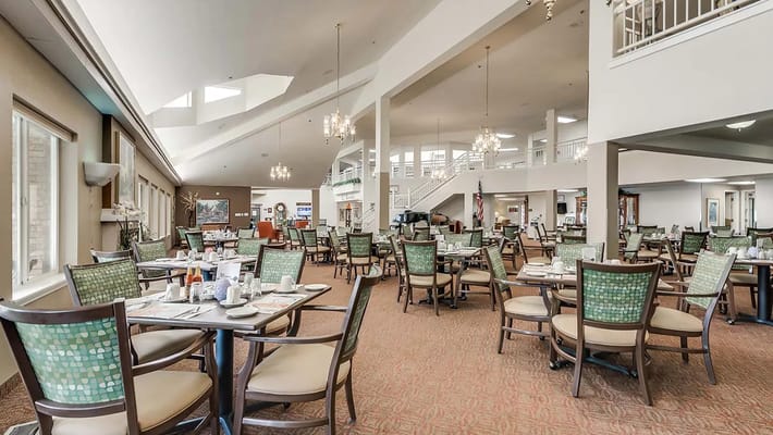 Dining room setup with tables and chairs