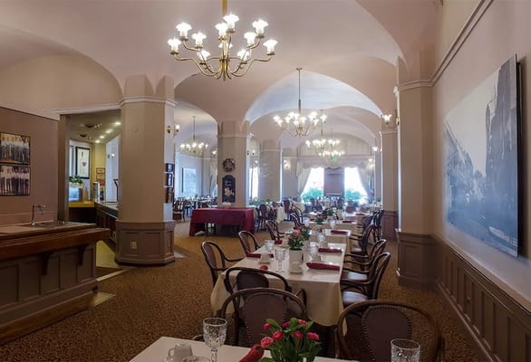 Dining room setup with elegant decor and tables