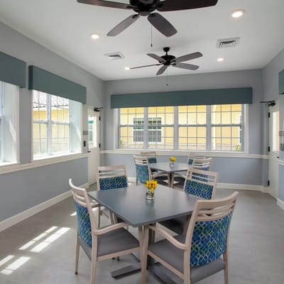 Sunny common area with tables and chairs