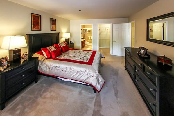 A well-furnished private resident room with an inviting decor