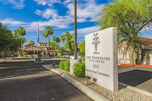 Entrance sign of The Fountains at La Cholla senior living community