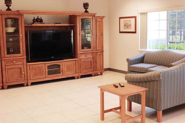 Bright common area with a television and seating