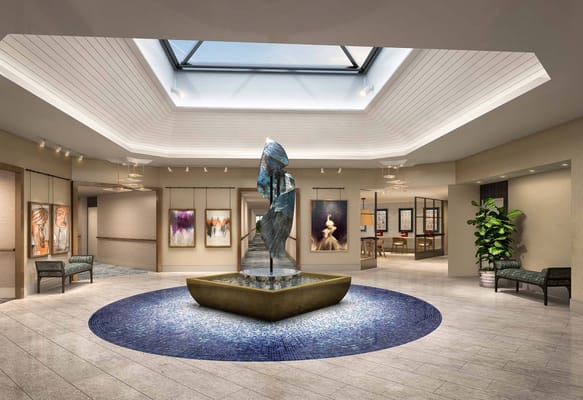 Common area with a fountain and artwork