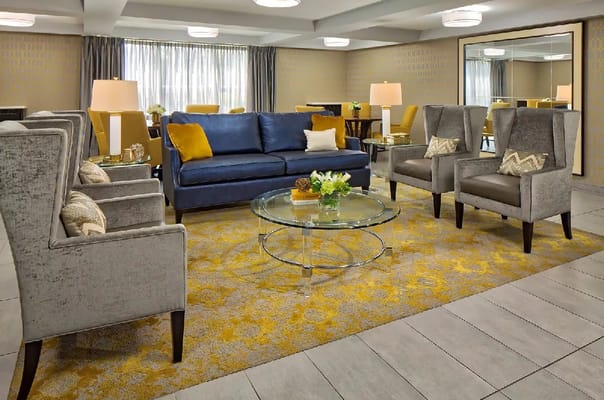 Stylish living room with blue sofa and modern decor