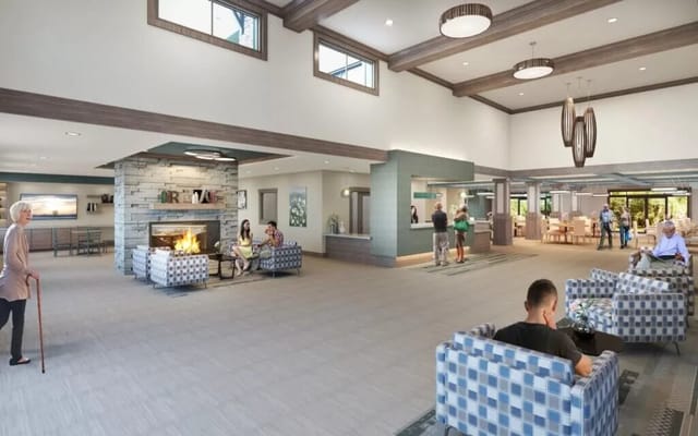 Spacious lobby with seating areas and a fireplace