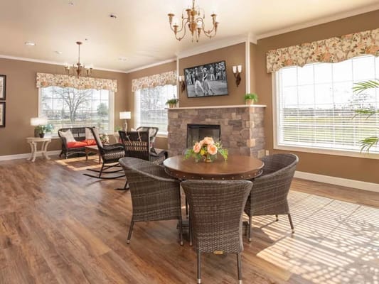 Bright and inviting living room with a round table and seating area