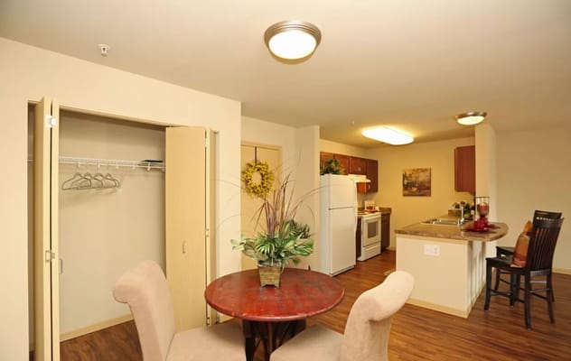 Cozy resident room with dining area and kitchen