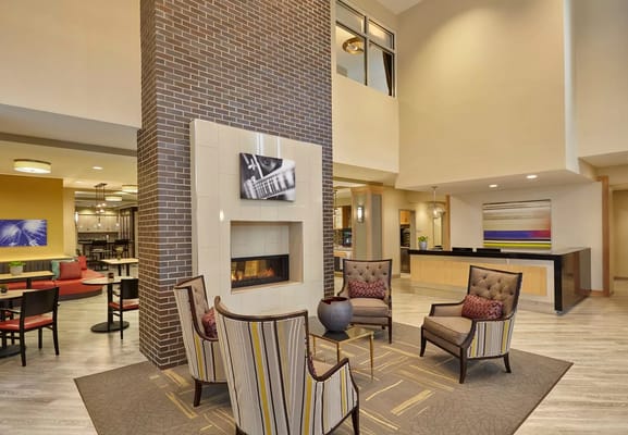 Cozy lobby area with seating and a fireplace