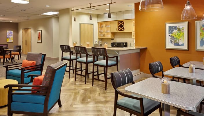 Modern lounge area with seating and a bar