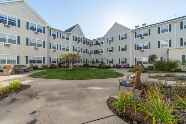 Serene courtyard with seating areas and garden at The Hearth at Glastonbury.