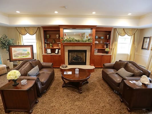 Lounge area with leather sofas and fireplace at The Hearth at Glastonbury