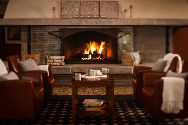 Cozy seating area with a fireplace in the lounge
