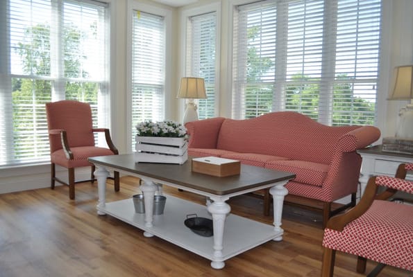 Cozy living room with a sofa, armchairs, and a coffee table