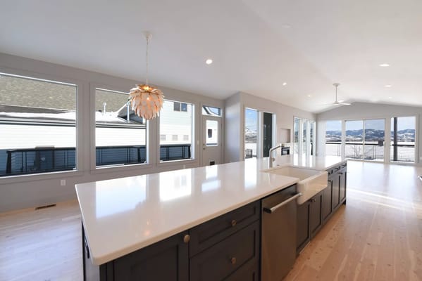 Modern kitchen with large windows and a view of the mountains