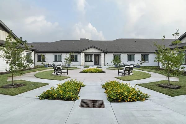 Landscaped courtyard with seating and flowering plants